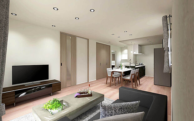 家族の会話が弾む一体型のLDK設計。木目調フロアのシンプルな内装は家具を選びません。リビング横のスライドドアは、収納や洋室へのアクセスに加え、急な来客にも対応可能です。