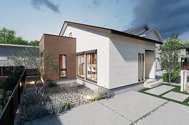 白を基調とした外壁に木目を組み合わせた、落ち着きのある外観。
1.5階建てならではの低く伸びやかな大屋根のシルエットが、平屋のような安定感と美しい佇まいをつくります。
