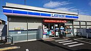 コンビニ「ローソン日野高幡店まで697m」