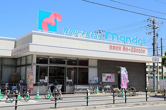 万代苅田店まで...