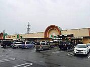 スーパー「ドミー幸田店まで129m」