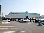 スーパー「トミダヤまで1500m」