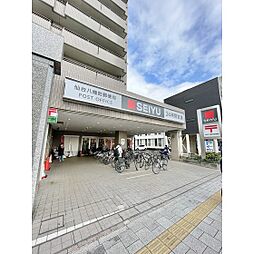 スーパー「西友八幡町店まで608ｍ」