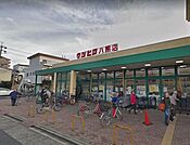 ウシヒロ八熊店 徒歩12分。 950m