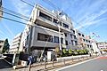 狛江市役所　距...