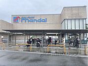 万代　萱島店まで1800メートル