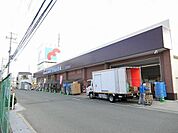 万代堺草部店 1140m