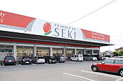 ドラッグストアセキ中曽根店まで891m