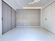 ベッドルーム 約6.0帖／アクセントクロスと間接照明がお洒落な空間を演出します。