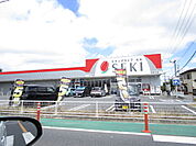 ドラッグストアセキ花野井店まで1505m