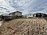 外観：造成中の敷地と周辺の住宅