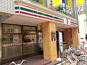 【コンビニエンスストア】セブン-イレブン京成大久保駅前店まで665ｍ